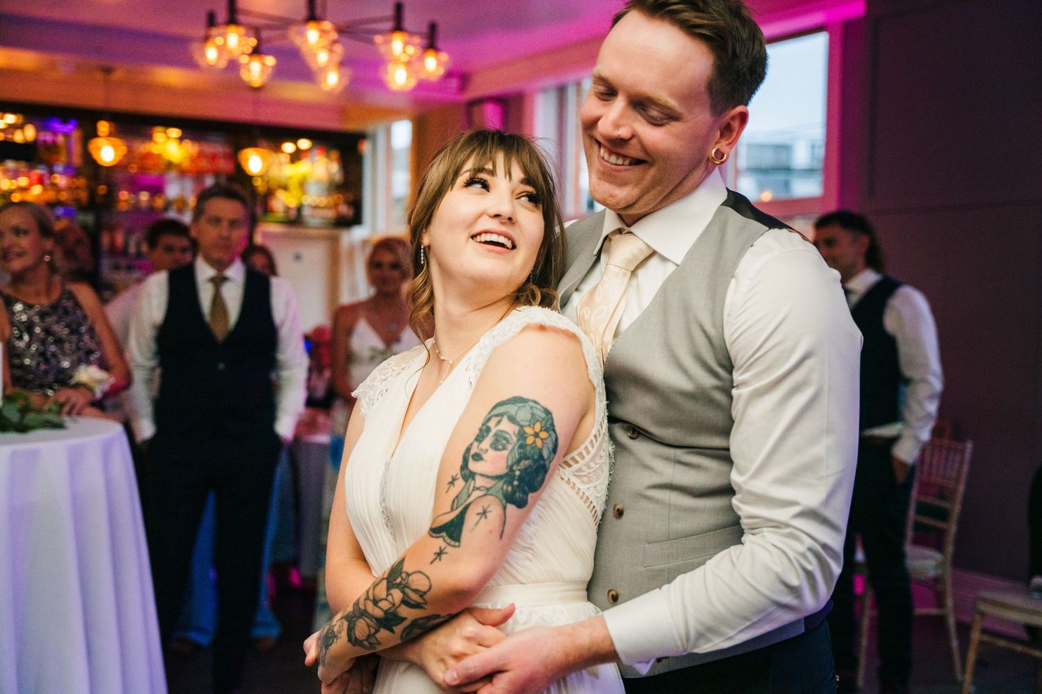 Wedding reception dance floor with purple and pink mood lighting. PHOTOGRAPHER Dublin Ireland Wedding