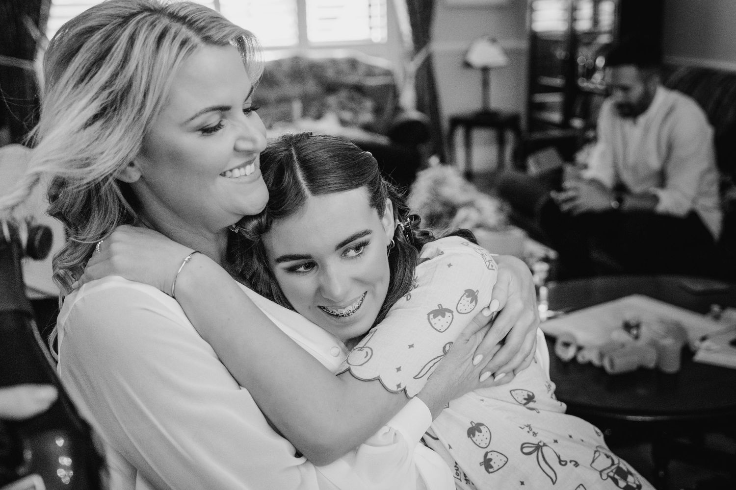 Black and white montage capturing emotional embraces during a wedding preparation. The Dean Dublin Wedding Photographer