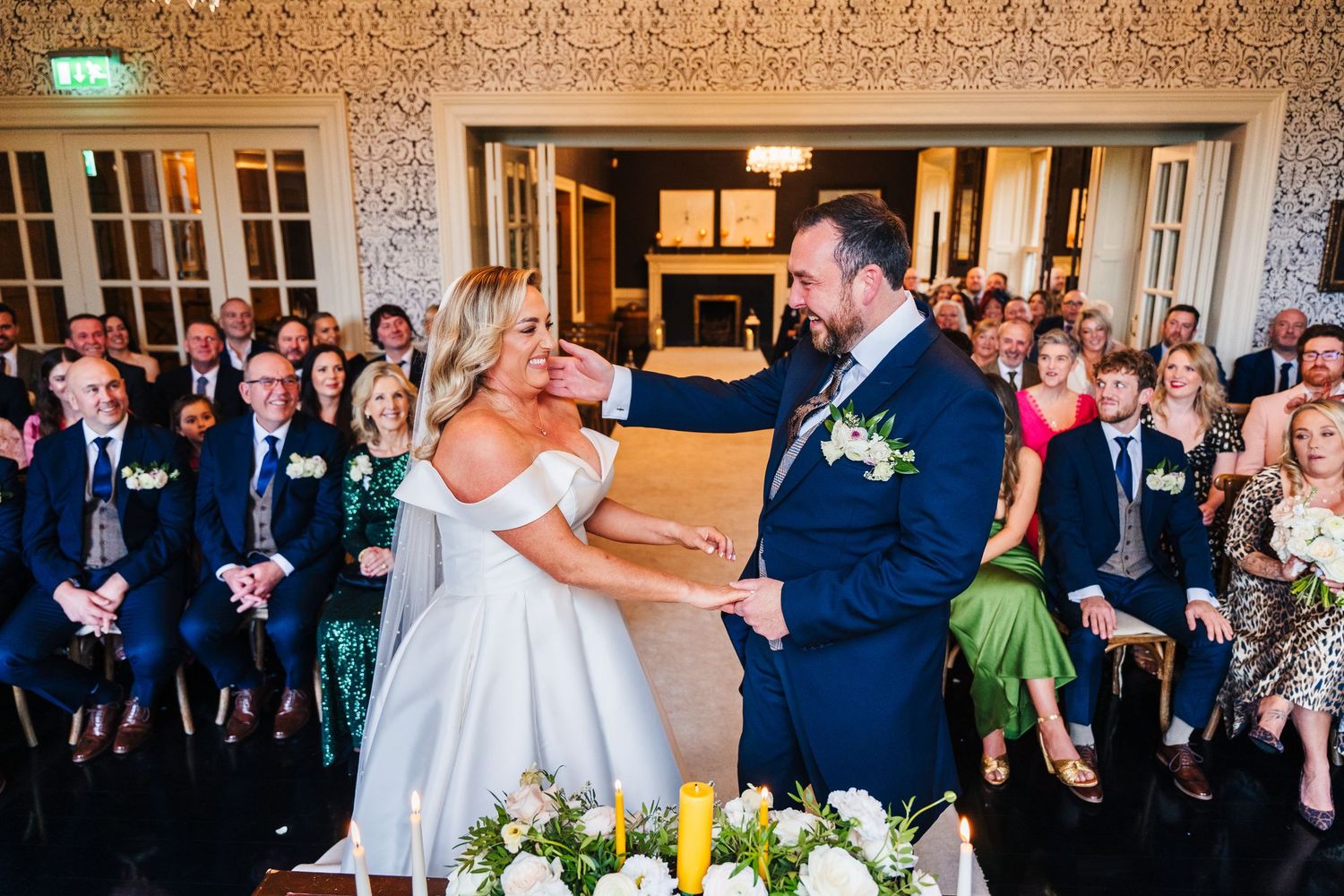 Guests watch as a couple shares their first dance in a beautifully decorated reception venue.  Virginia Park Lodge Wedding Photographer Cava