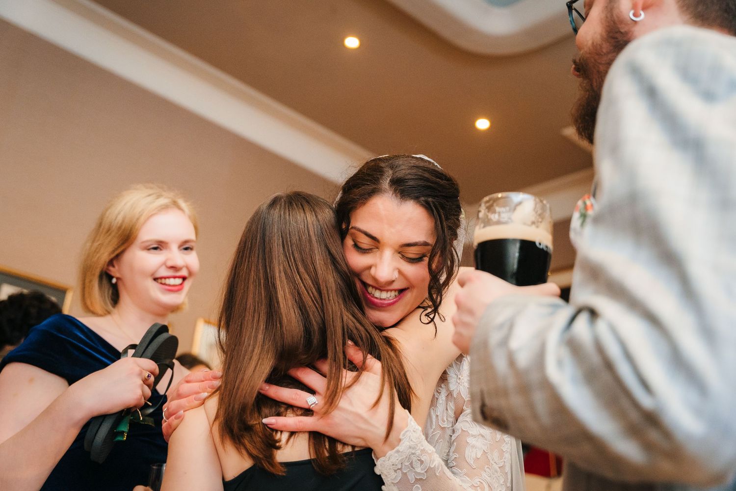 Candid moments of laughter and joy captured during wedding reception festivities. Stephens green club dublin Wedding photographer