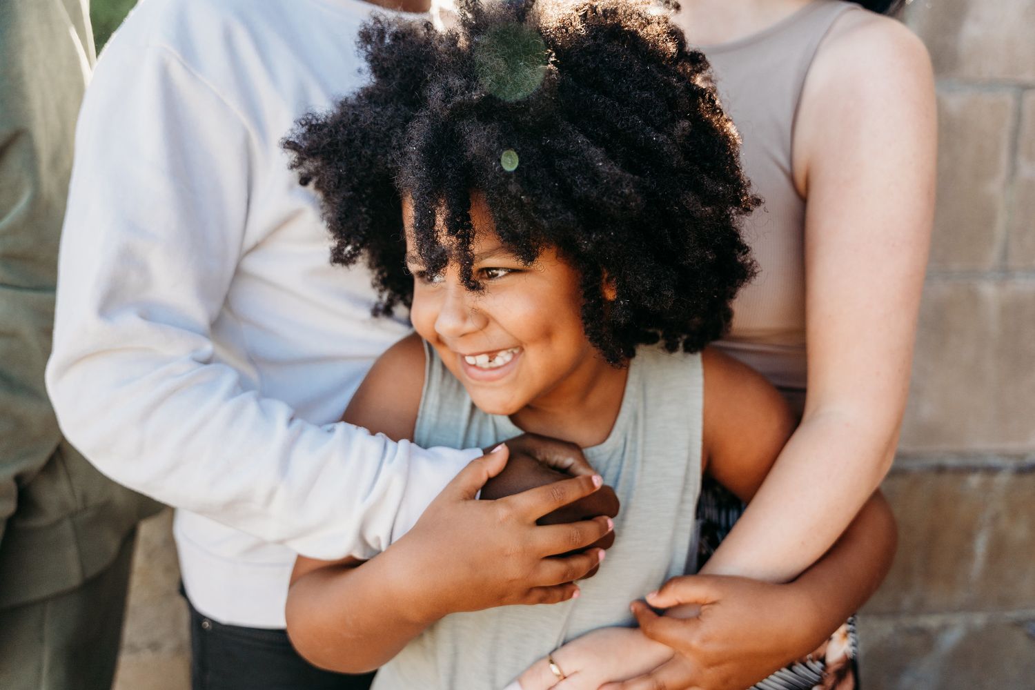 Intimate family portrait showing tender embrace and joyful smiles. Family PHOTOGRAPHER Dublin