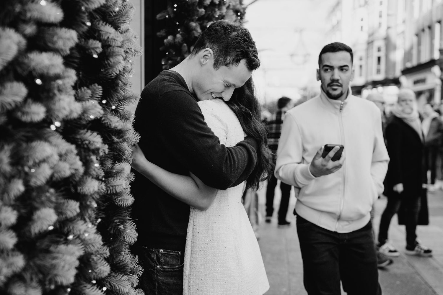 A sequence of black and white candid photographs shows wedding guests dancing together at a reception celebration. Surprise proposal dublin
