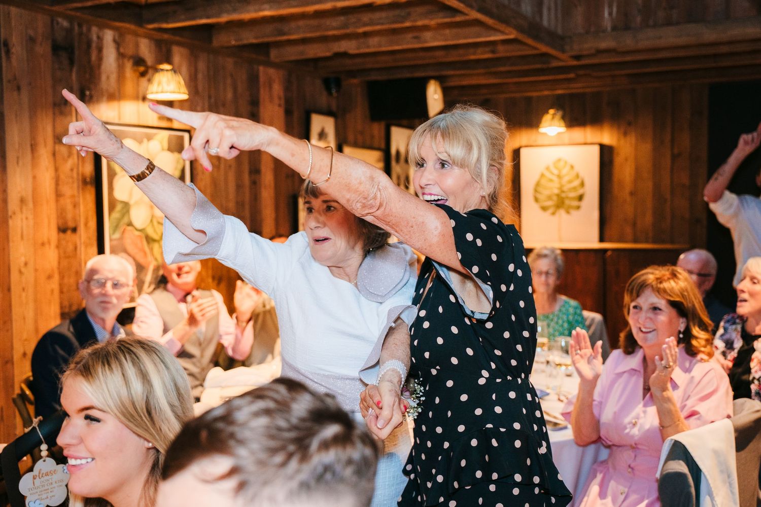 Wedding reception celebration in a rustic barn venue with guests dancing and celebrating. The Dean Dublin Wedding Photographer