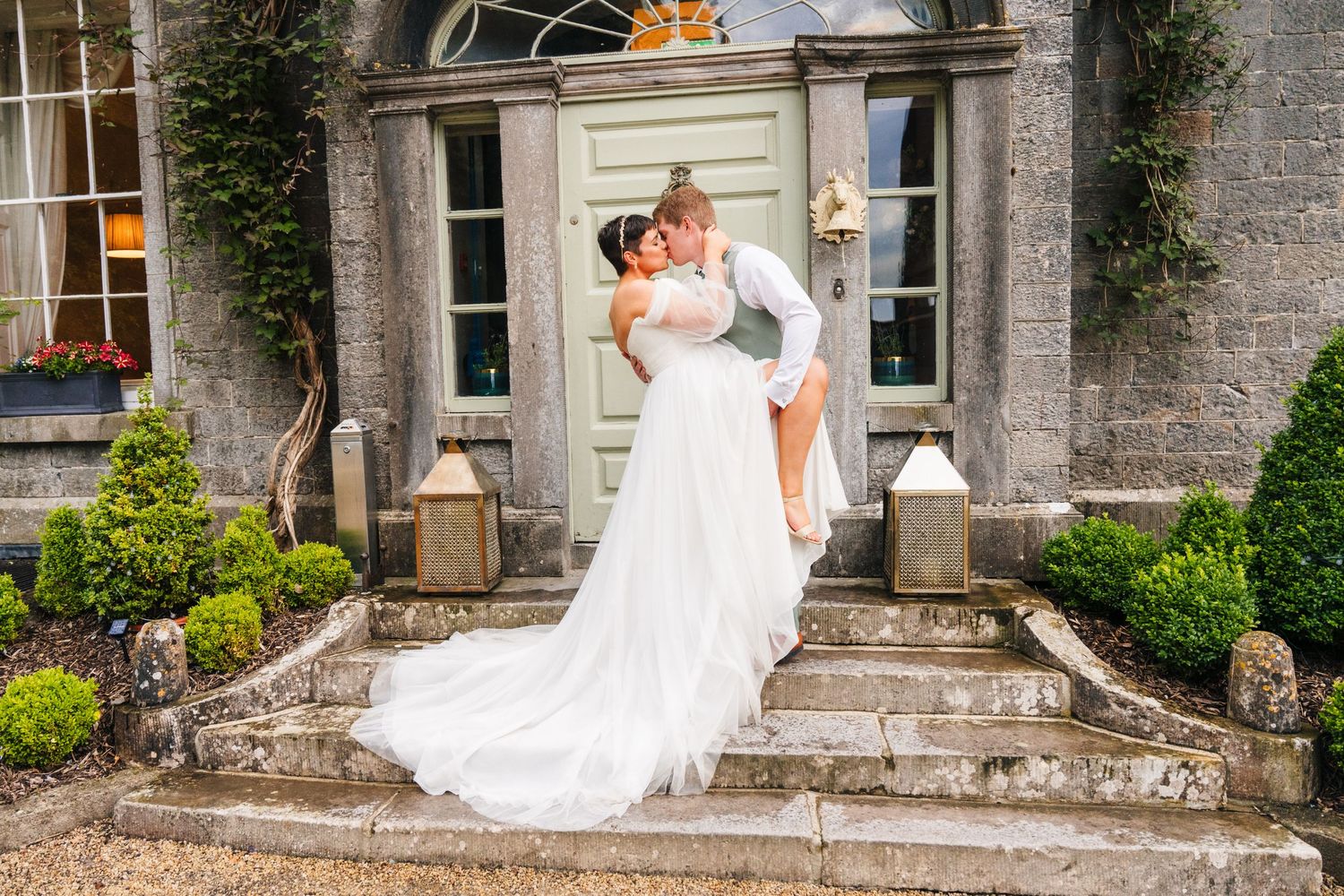 Millhouse slane wedding photographer dublin Romantic wedding photos captured outside a stately stone mansion with climbing ivy.