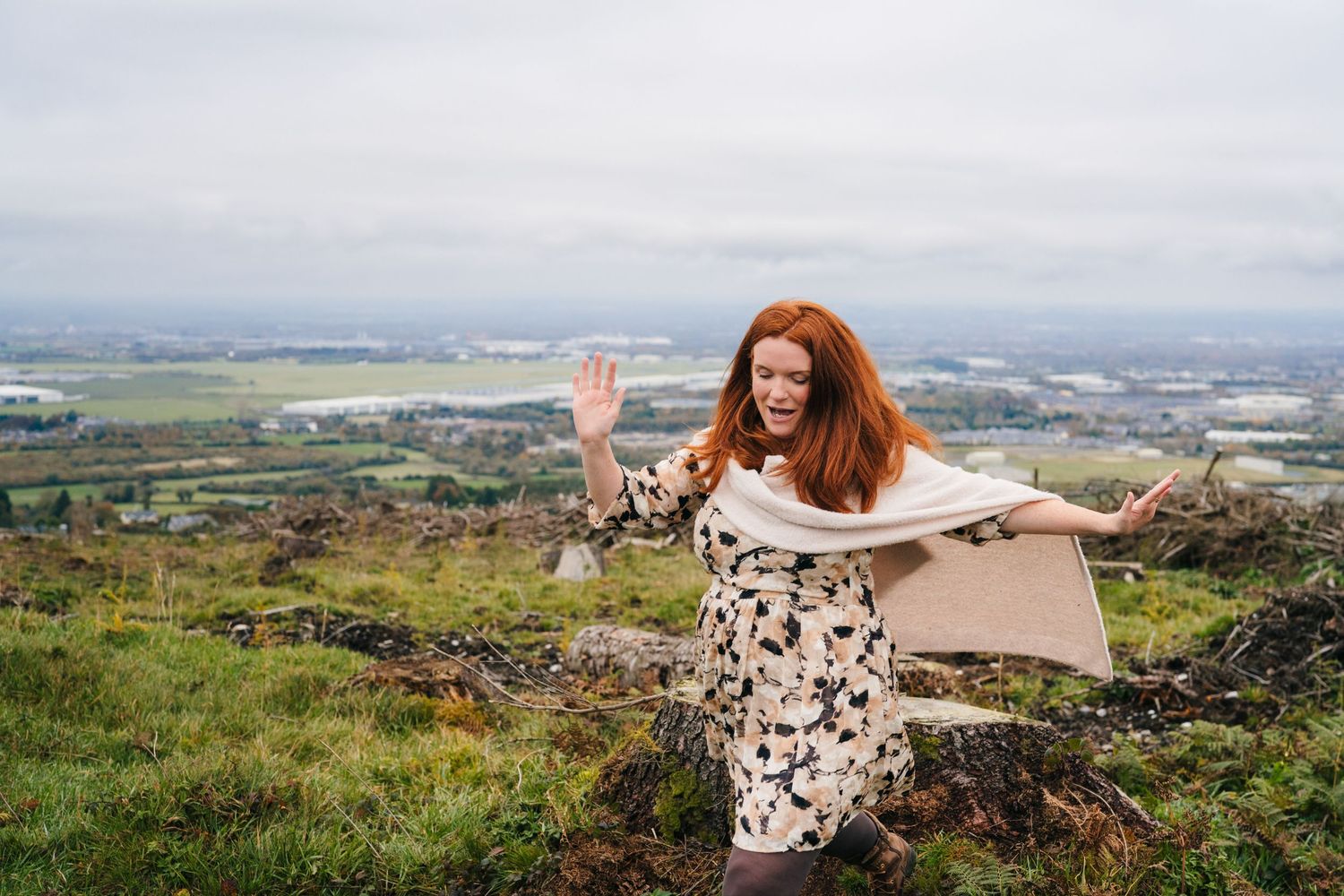 Family Photographer Dublin Ireland Candid family photography session on scenic hilltop overlooking rolling countryside landscape.