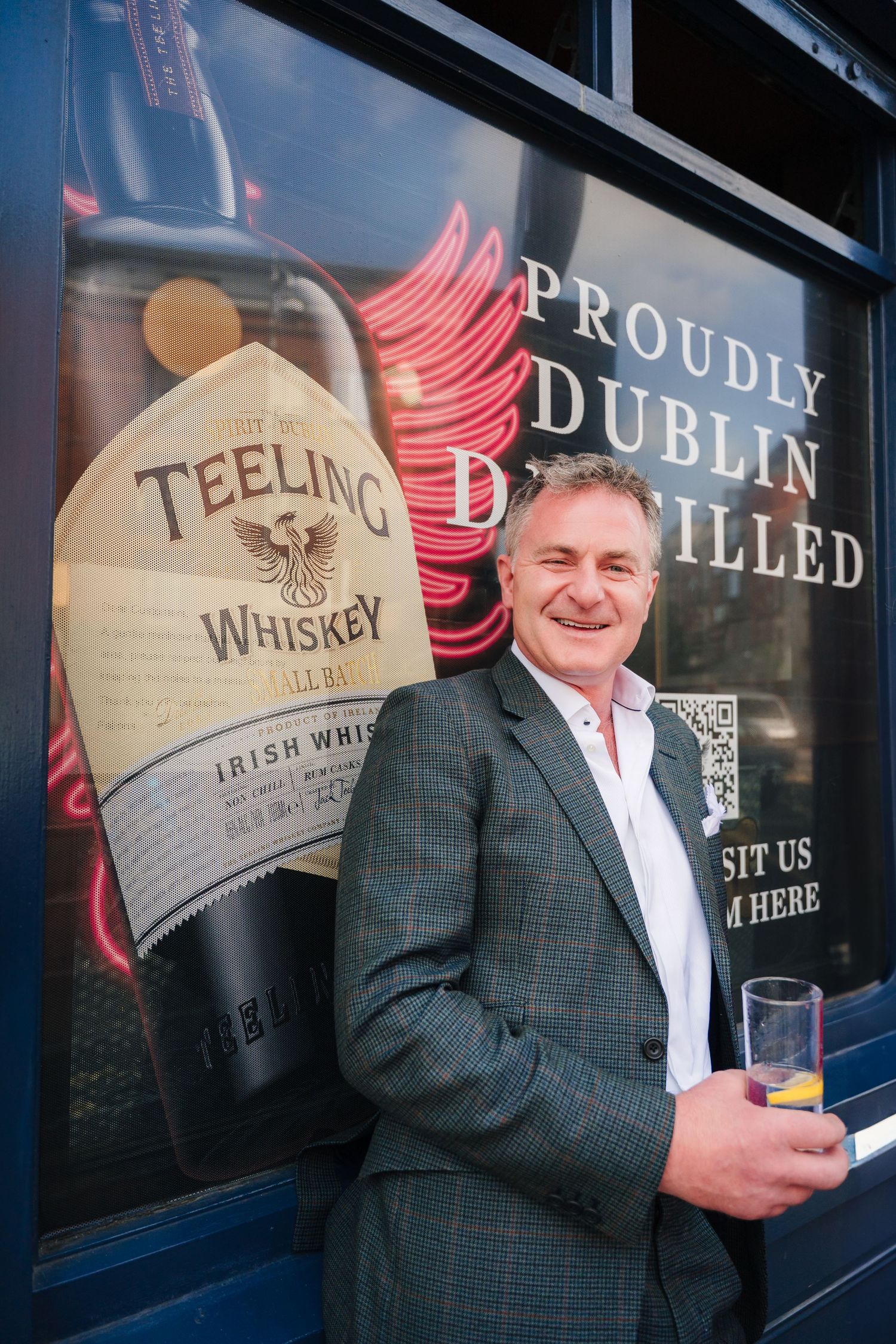 A Teeling Whiskey advertisement displayed on a storefront window in Dublin. Same sex wedding PHOTOGRAPHER Dublin