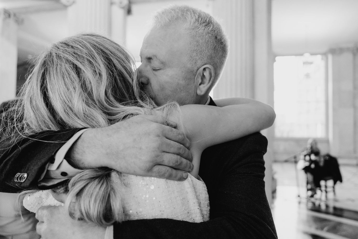 An emotional black and white moment captured during a wedding celebration. City Hall Dublin wedding photogrAPher