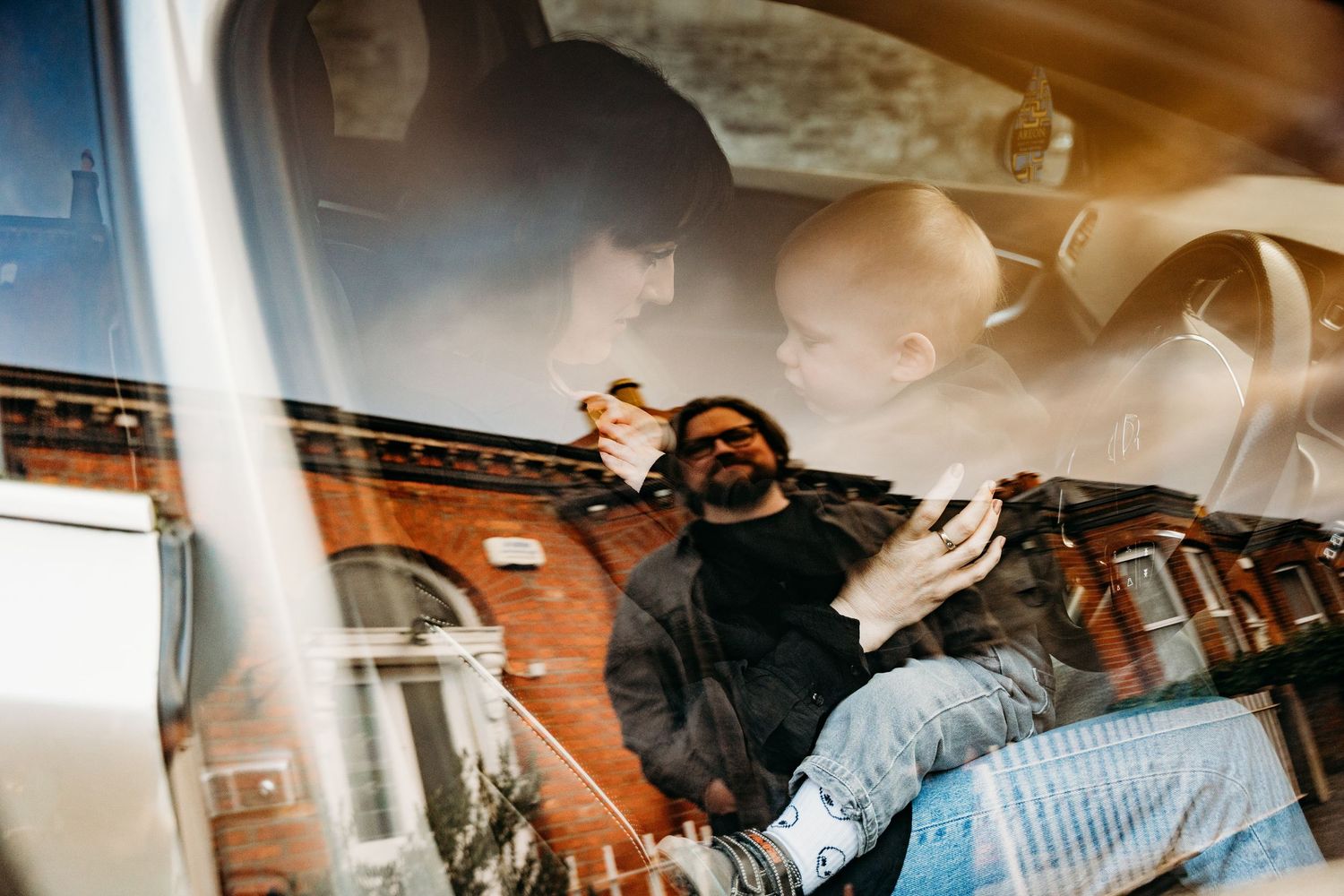 Artistic car interior shot with sunlight streaming through windows creating atmospheric effect.  Family PHOTOGRAPHER Dublin