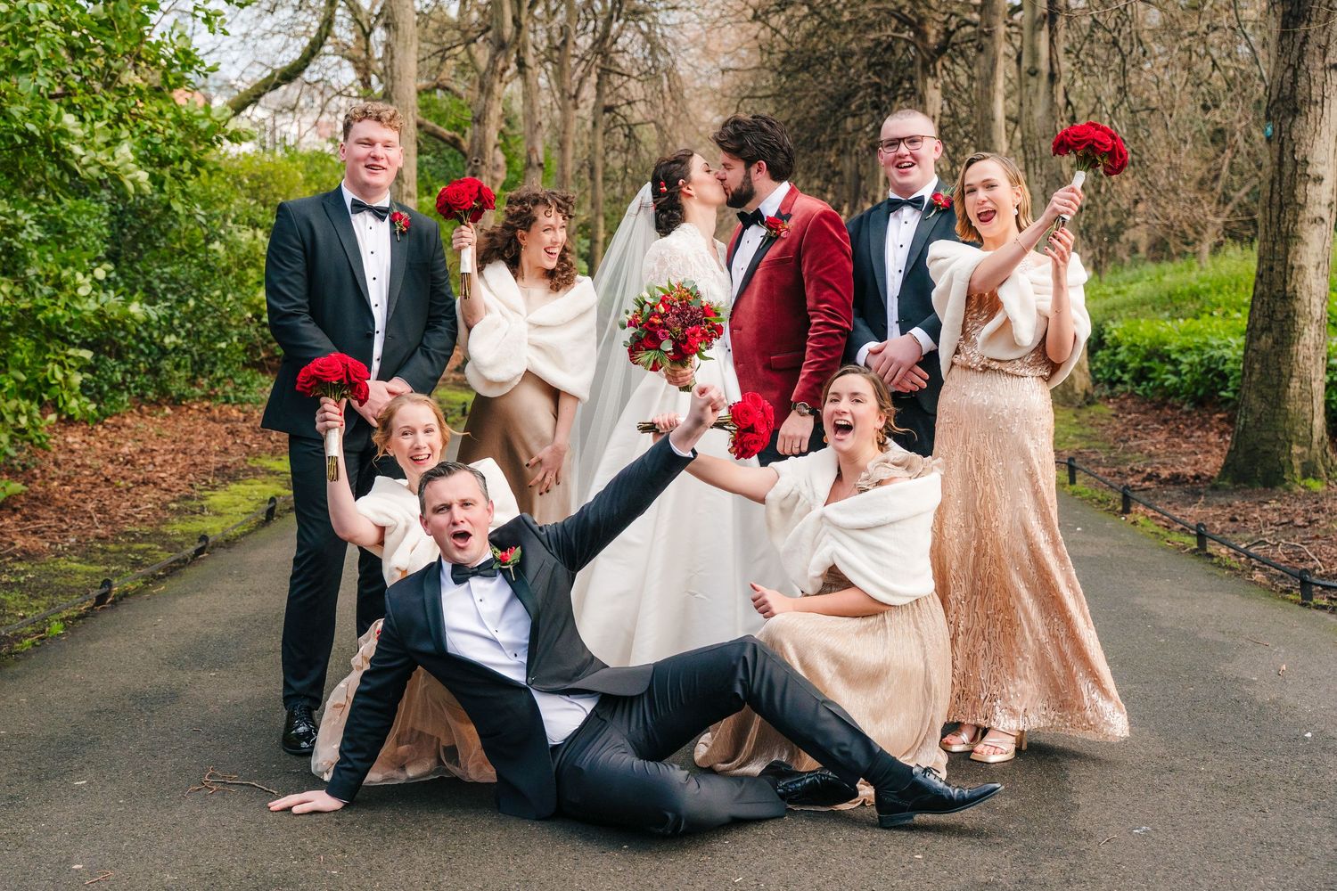 Wedding party members pose together in a casual and candid series of outdoor photos along a garden path. Wedding Photographer Dublin