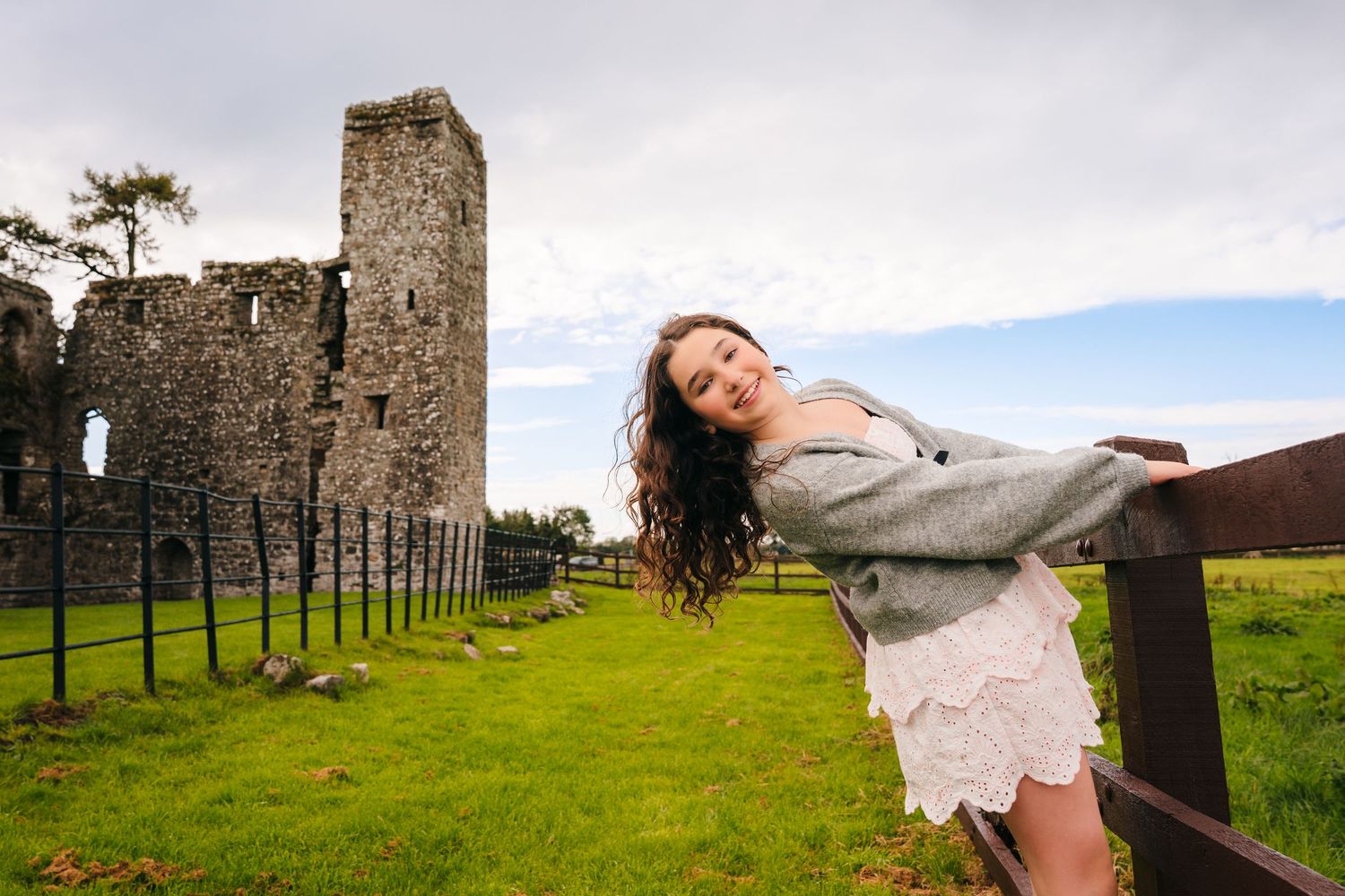 Scenic countryside views with historic stone ruins and green fields. BEctive abbey family photographer dublin