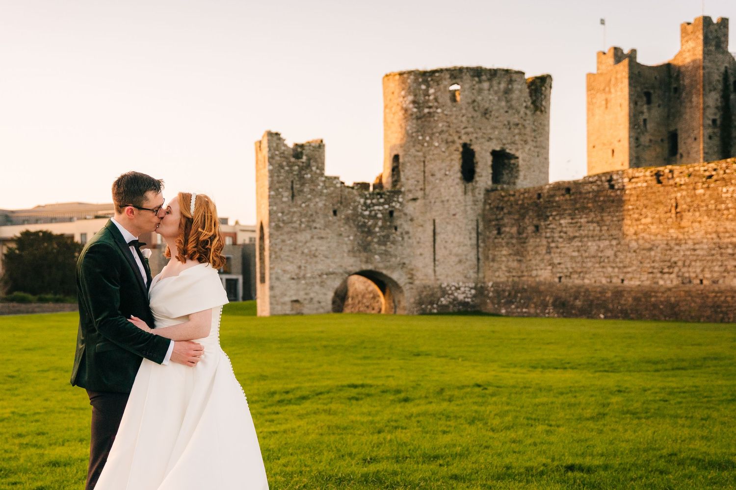 Romantic sunset portrait with historic castle ruins in background.  Wedding PHOTOGRAPHER Trim Castle