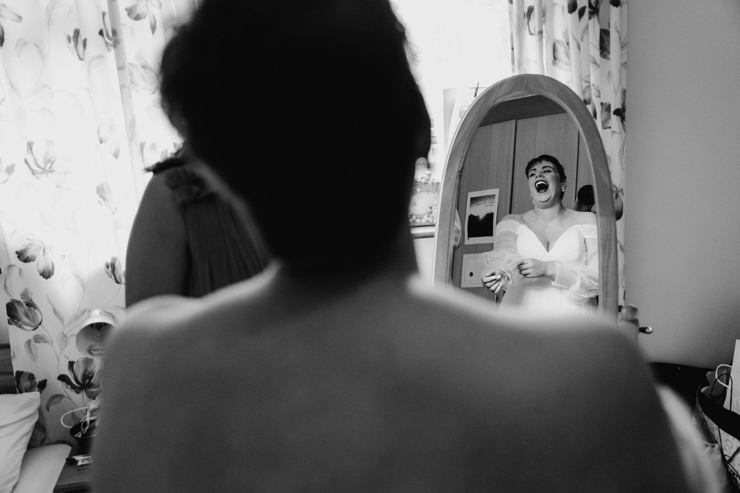 Black and white photograph showing a medical team working in a hospital operating room. Millhouse slane wedding photographer dublin