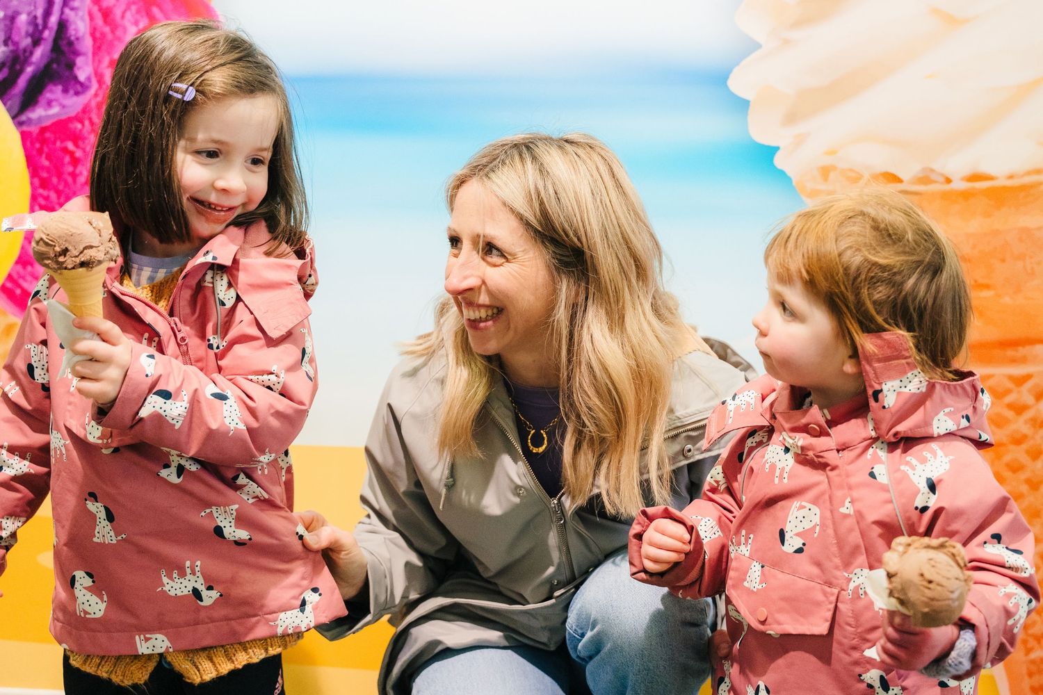 Parents and children enjoying playful moments together against colorful backgrounds. PHOTOGRAPHER Dublin