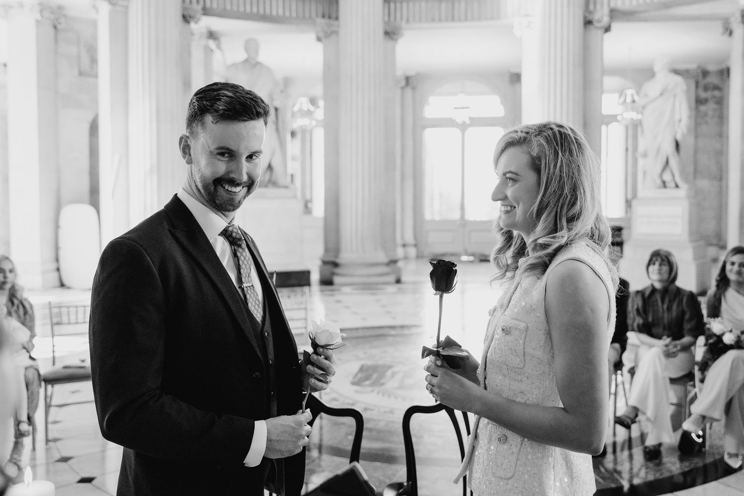 Black and white photo series of guests socializing at an elegant wedding reception. City Hall Dublin wedding photogrAPher
