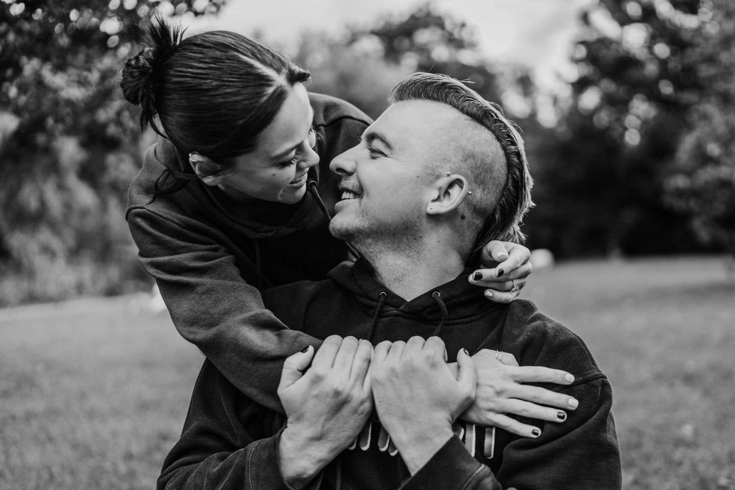 Black and white romantic scene of two people embracing outdoors. PHOTOGRAPHER Dublin Ireland