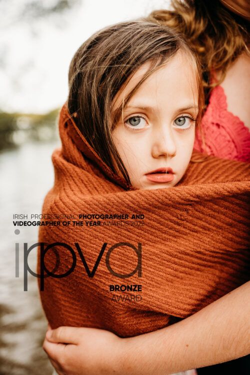 Close-up portrait with rustic orange scarf creating texture and warmth. PHOTOGRAPHER Dublin