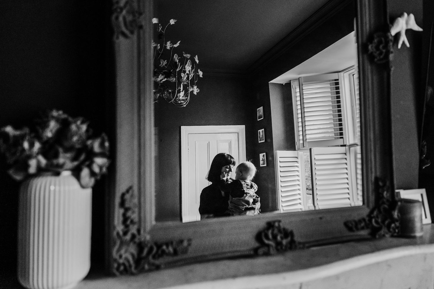 Family PHOTOGRAPHER Dublin Three different views of a dark room with sunlight streaming through windows and illuminating interior walls.