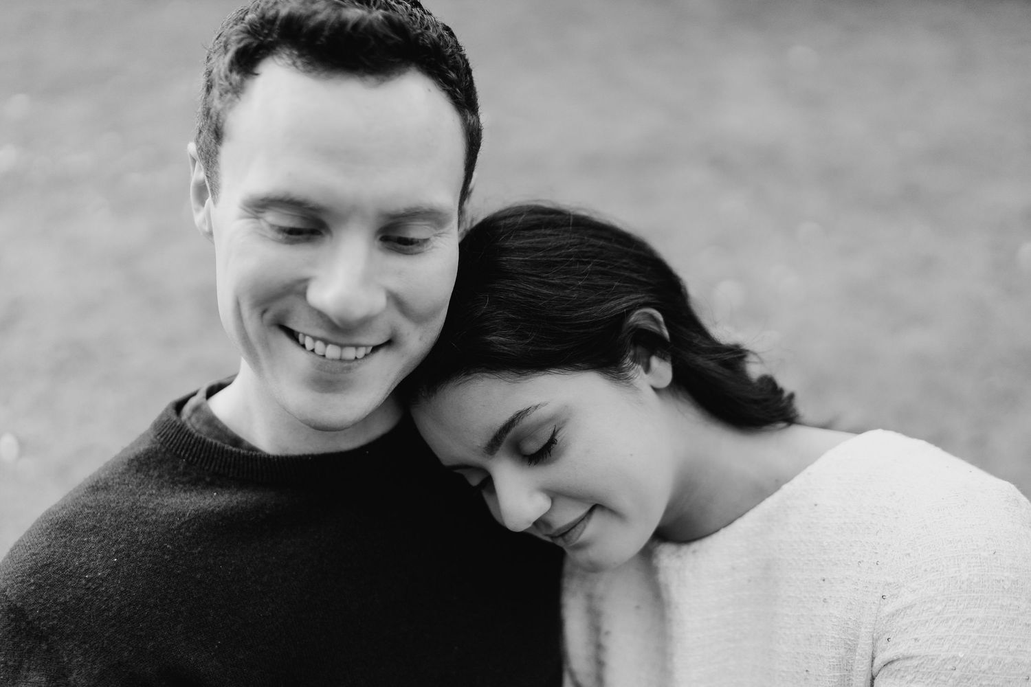 Black and white romantic couple portrait series featuring tender embraces and intimate moments captured in candid style. Surprise proposal d