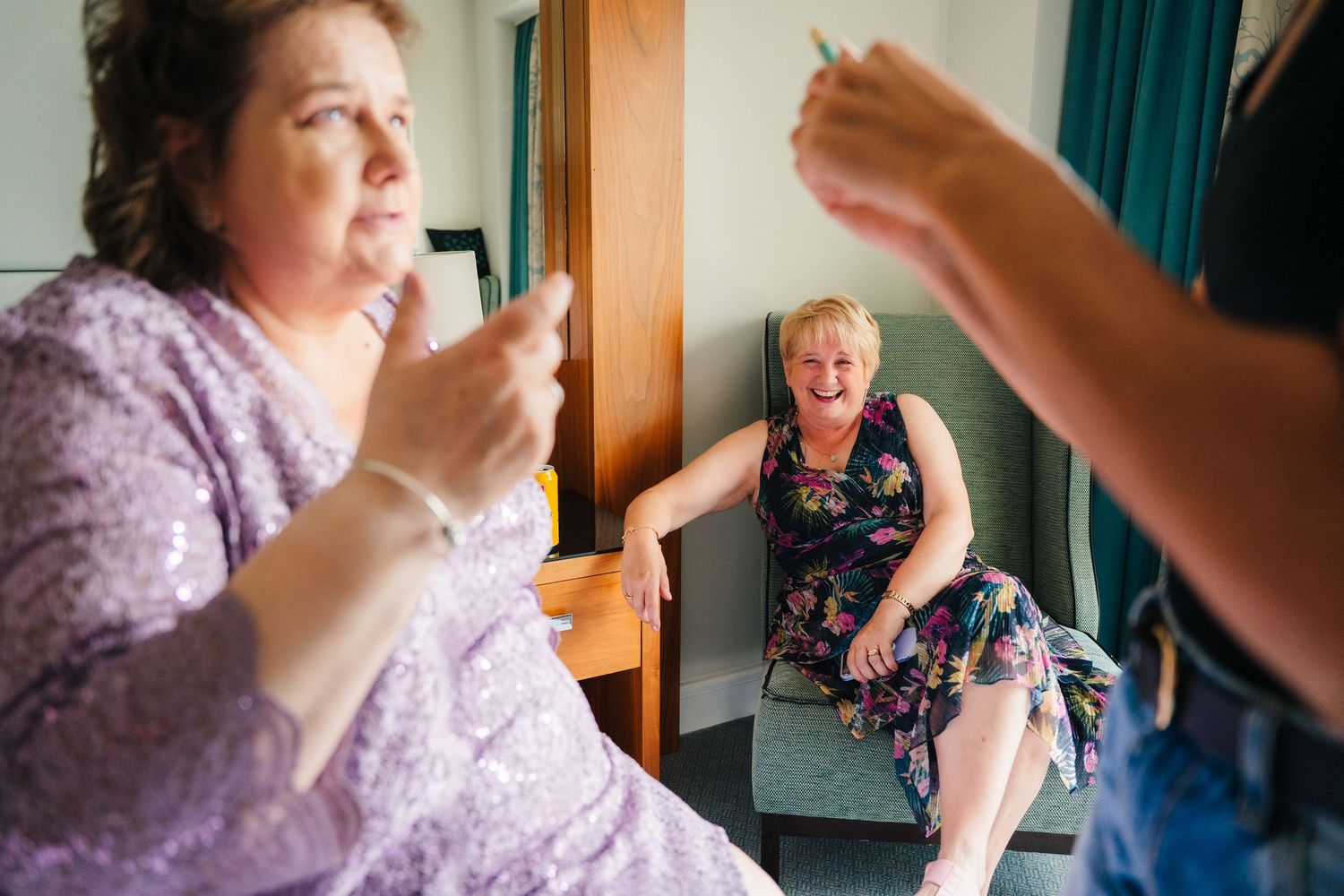 A series of candid photos showing emotional reactions and expressions during what appears to be a surprise moment indoors. Portmarnock Hotel