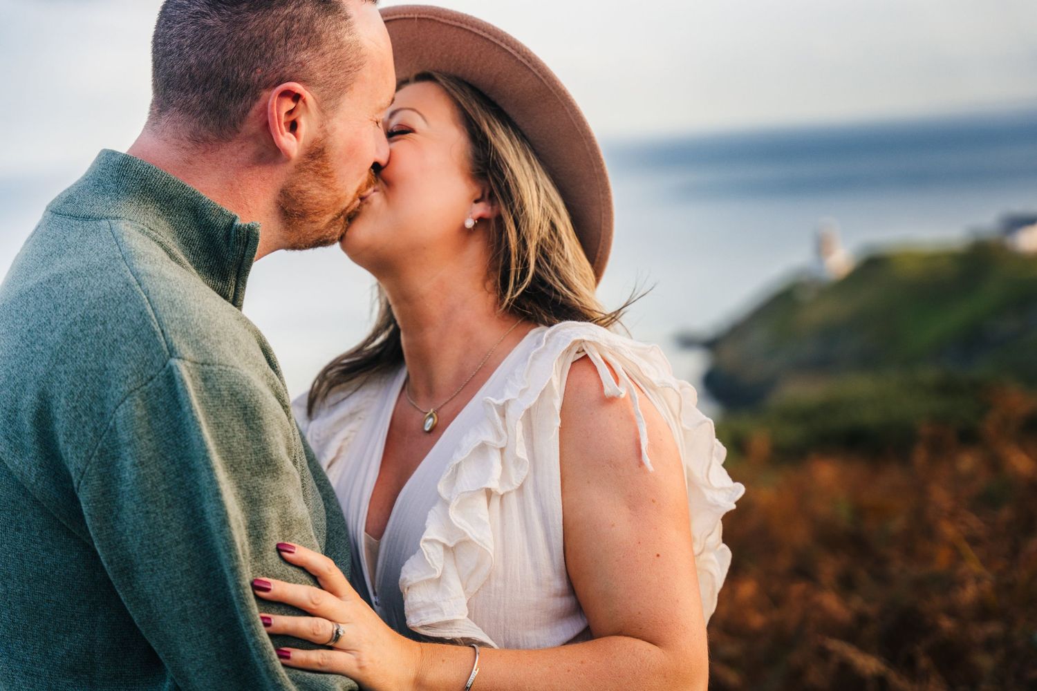 Romantic couple embracing in a beautiful natural setting during sunset with mountains in the background. PHOTOGRAPHER Dublin ireland