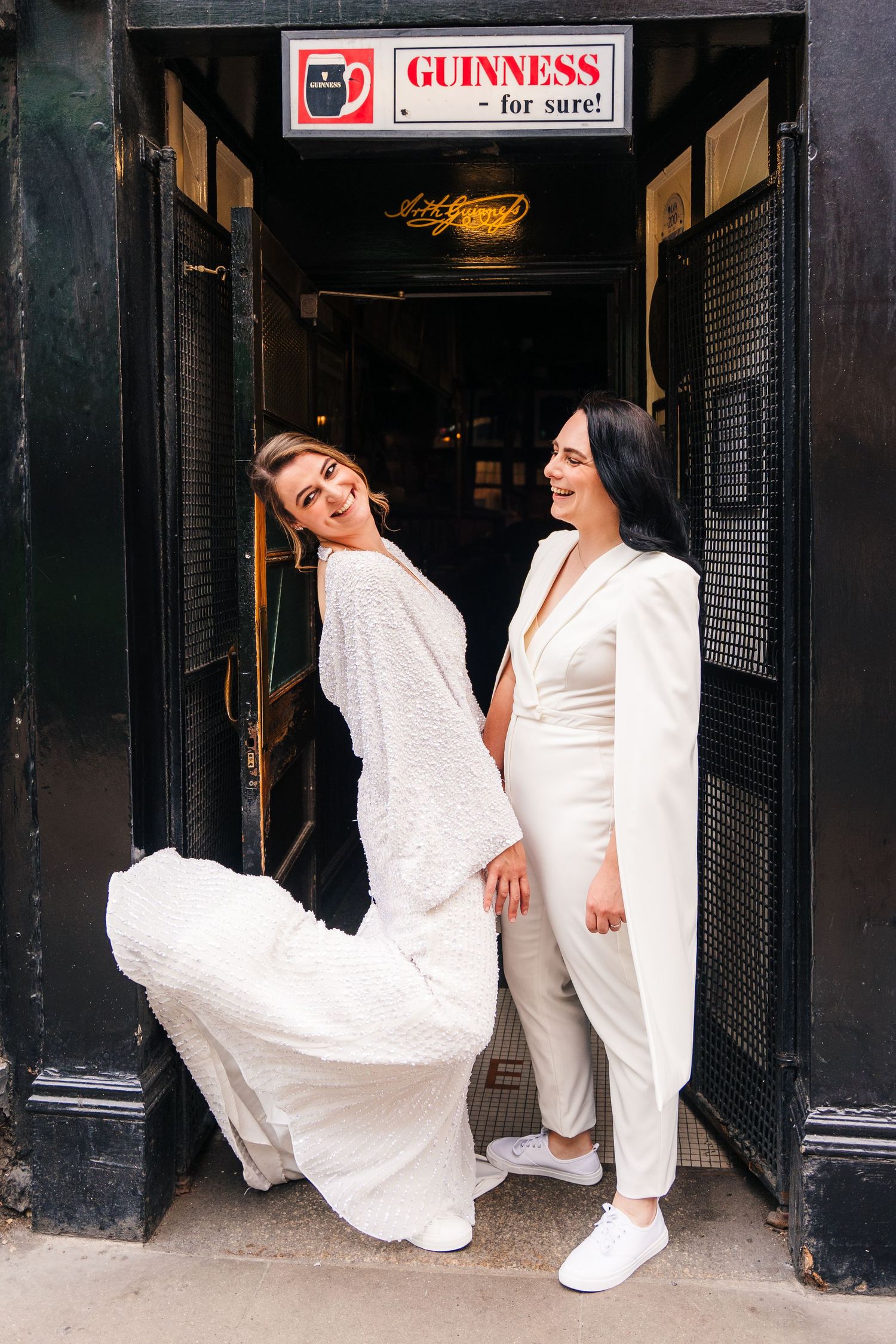 Playful photo sequence in white outfits against a dark storefront with Guinness signage. House Dublin Wedding Photographer