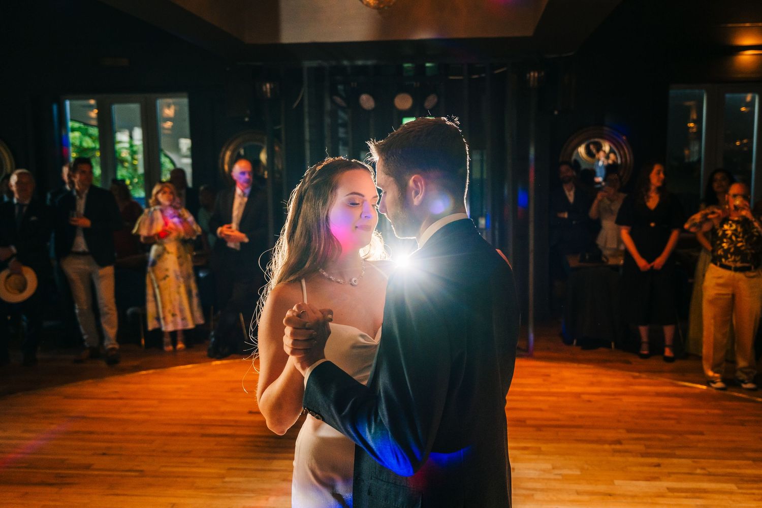 Poulaphouca Wedding photographer wicklow  Wedding reception dance floor at night with dramatic lighting and dancing silhouettes.