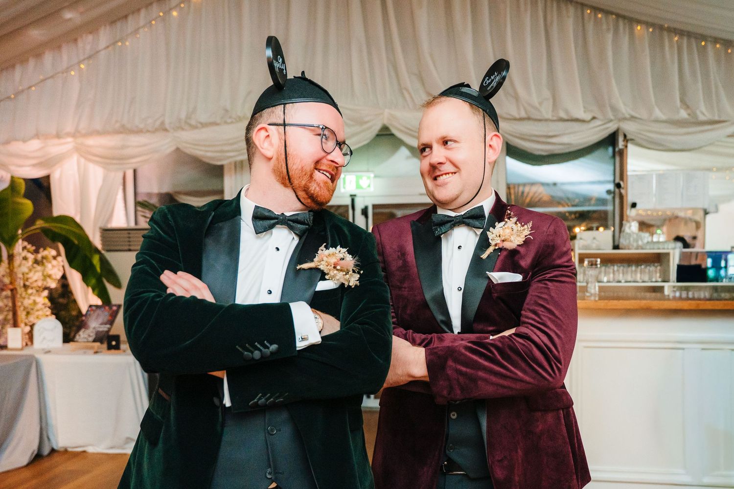 People dancing and celebrating at an elegant wedding reception under a white tent. LGBTQ Ashley Park Wedding Photographer