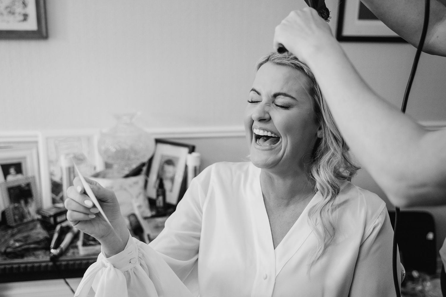 A black and white photo collage showing joyful candid moments of laughter and natural expressions. The Dean Dublin Wedding Photographer