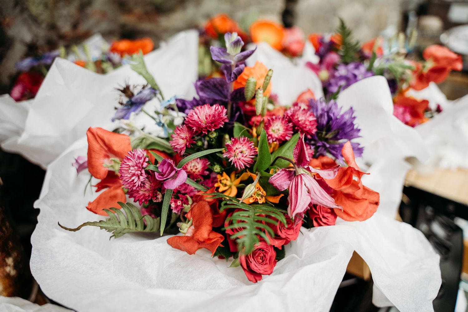 A vibrant bouquet of colorful flowers including orange lilies, pink roses, and purple blooms  Wedding photographer Dublin