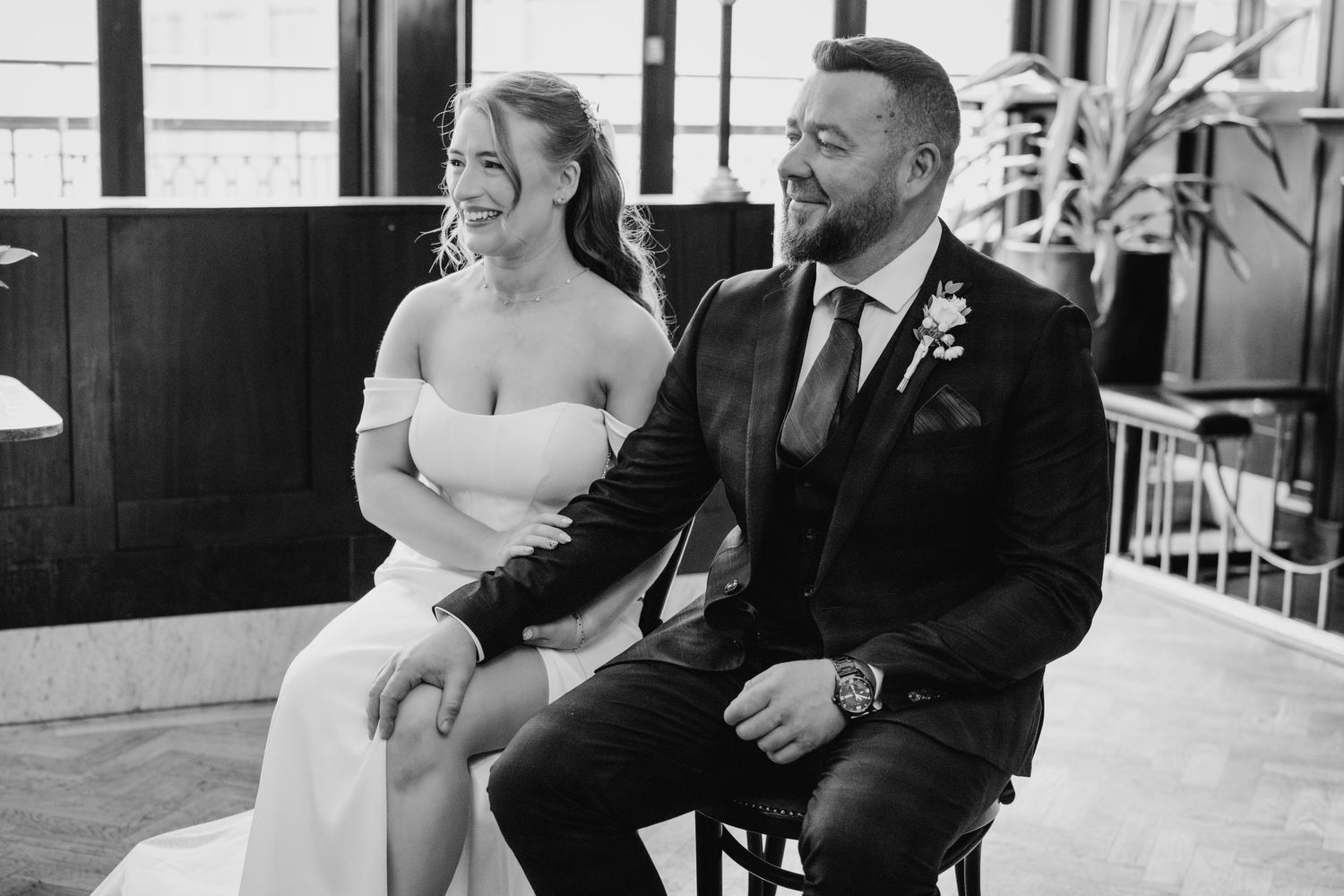 Black and white wedding photos showing candid moments between a couple during their celebration. Dublin wedding photogrAPher Bewleys Grafton