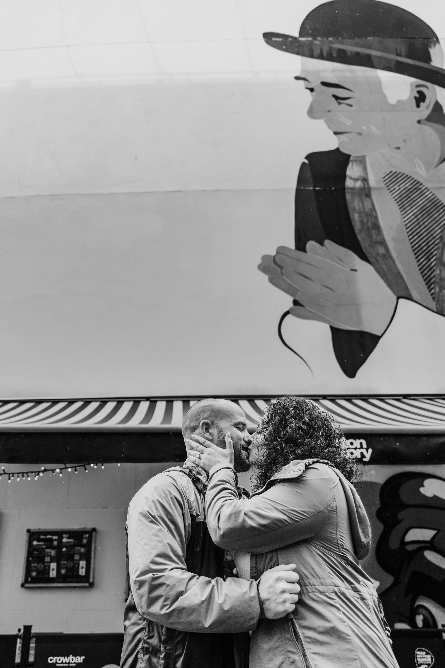 Series of black and white shots showing a couple embracing against a white background. Proposal Dublin Photographer