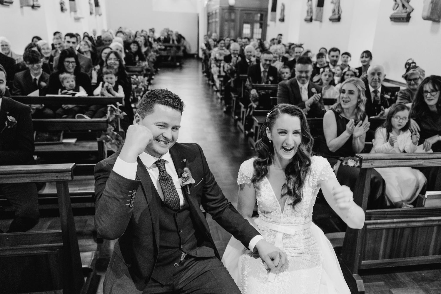 A collection of black and white wedding photographs showing guests laughing and celebrating in church pews. Wedding Photographer Dublin Irel
