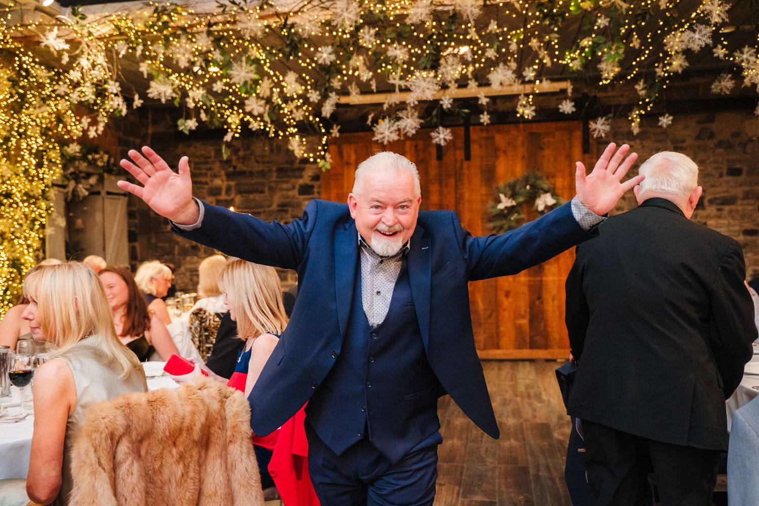 Wedding reception celebration with festive lighting and joyful dancing. Ballymagarvey Wedding photographer
