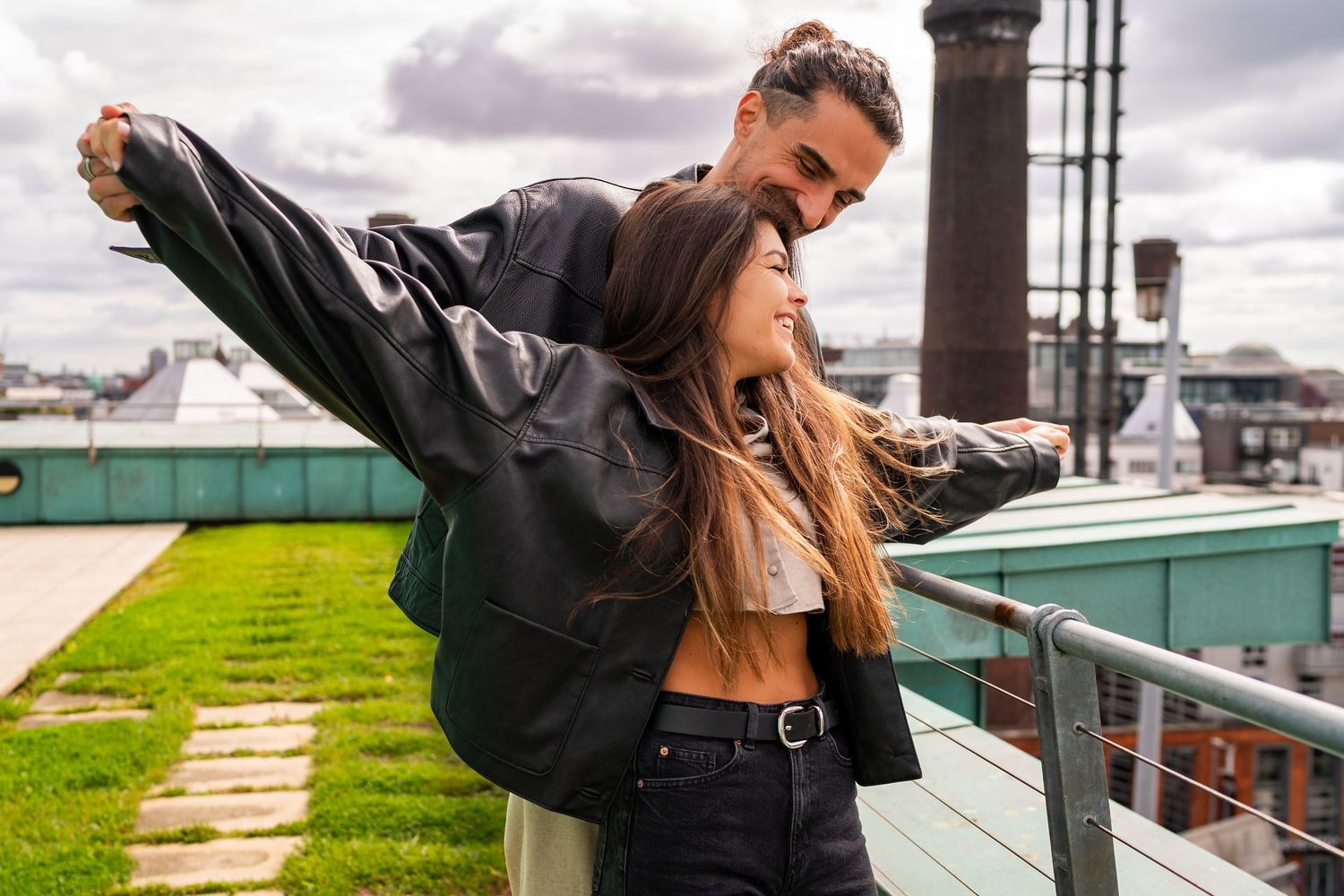 A sequence of artistic photos showing someone in a black leather jacket posing dynamically against an urban backdrop. Couple's Photoshoot PH