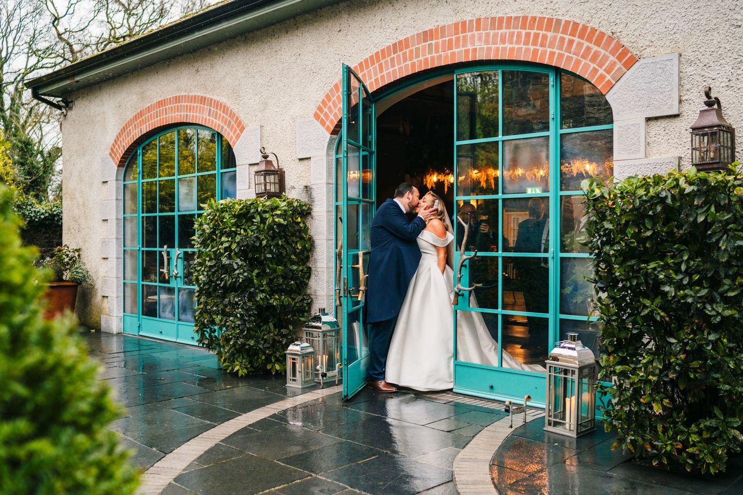 Wedding venue exterior features charming turquoise doors and archways with stone architecture.  Virginia Park Lodge Wedding Photographer Cav