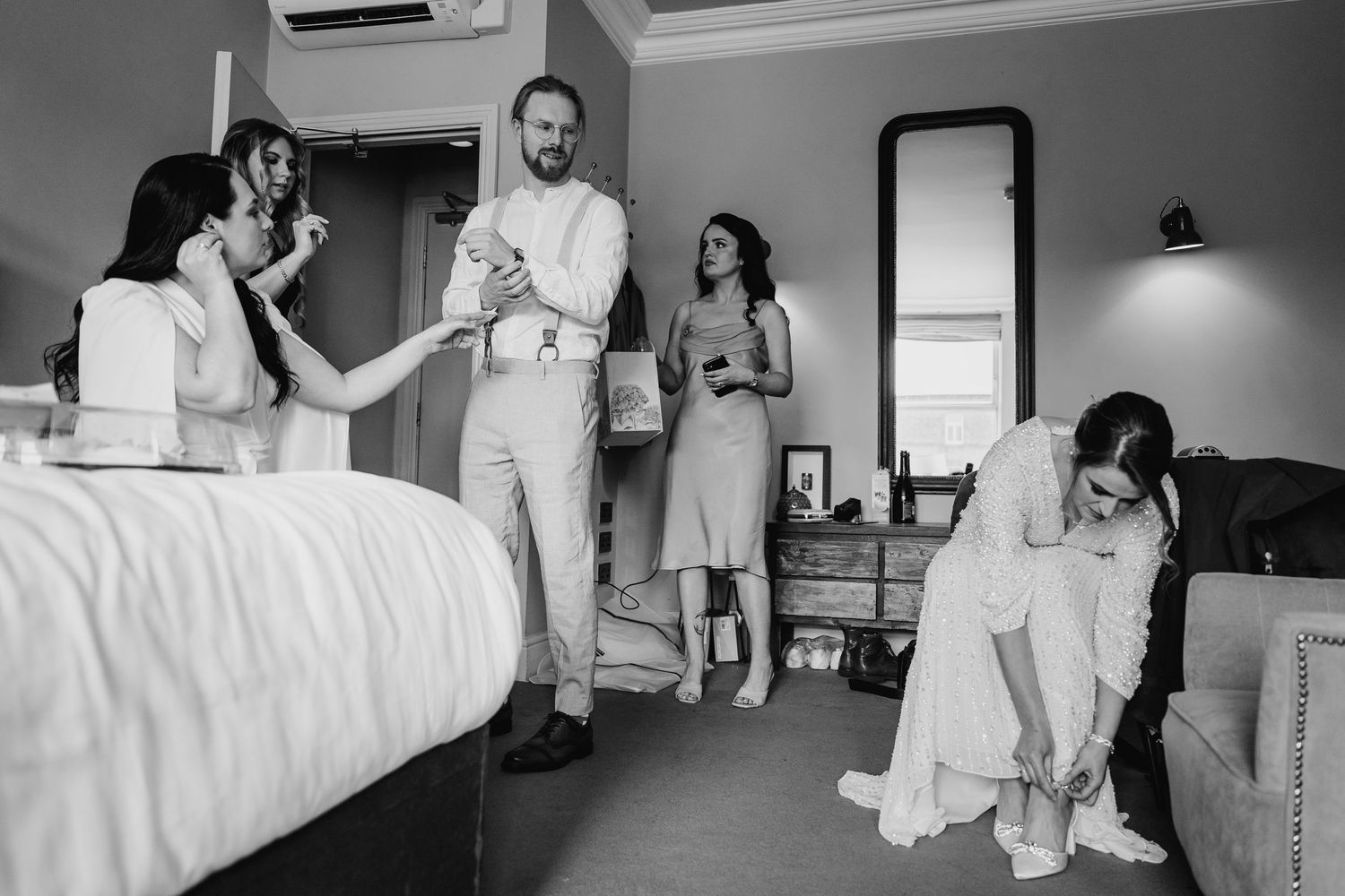 Black and white photo series showing medical professionals in hospital gowns and scrubs working in a healthcare setting. House Dublin Weddin