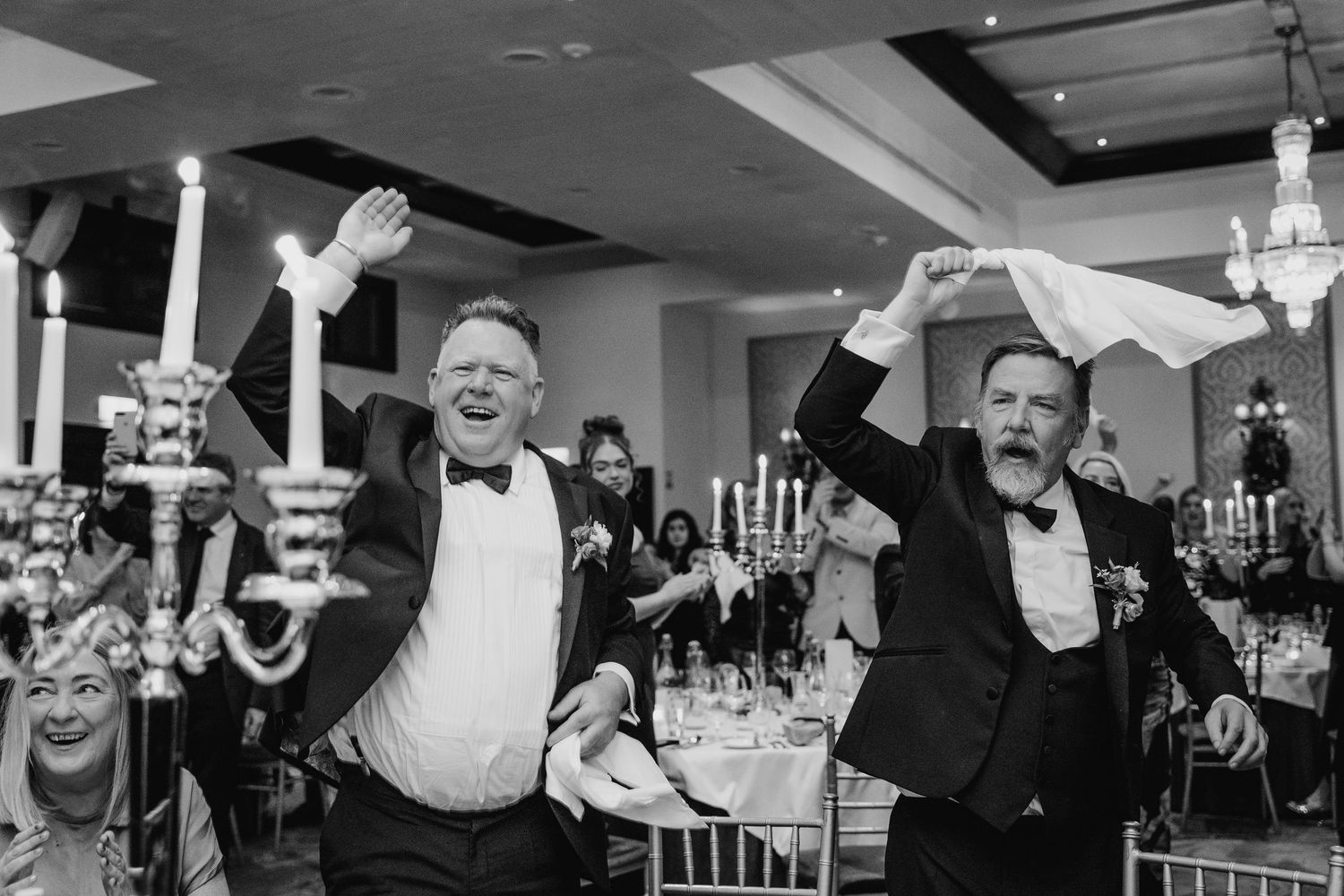 Black and white photos of joyful wedding reception celebrations with dancing and laughter. Wedding photographer dublin
