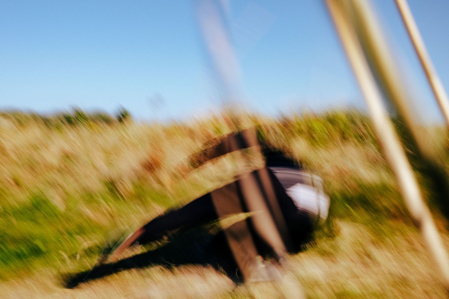 Blurred artistic shot of equipment in golden grass field. PHOTOGRAPHER Dublin