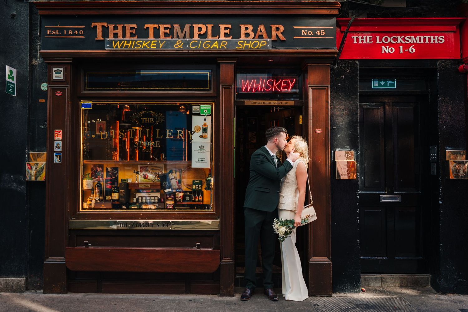 Historic Temple Bar district storefront with vintage signage and traditional Irish pub facade. City Hall Dublin wedding photogrAPher