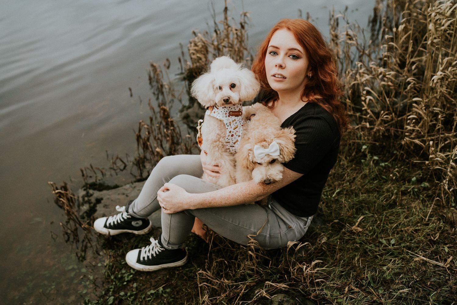 Contemporary artistic photography session by the water with warm tones and neutral earthy colors captured at golden hour. PHOTOGRAPHER Dubli
