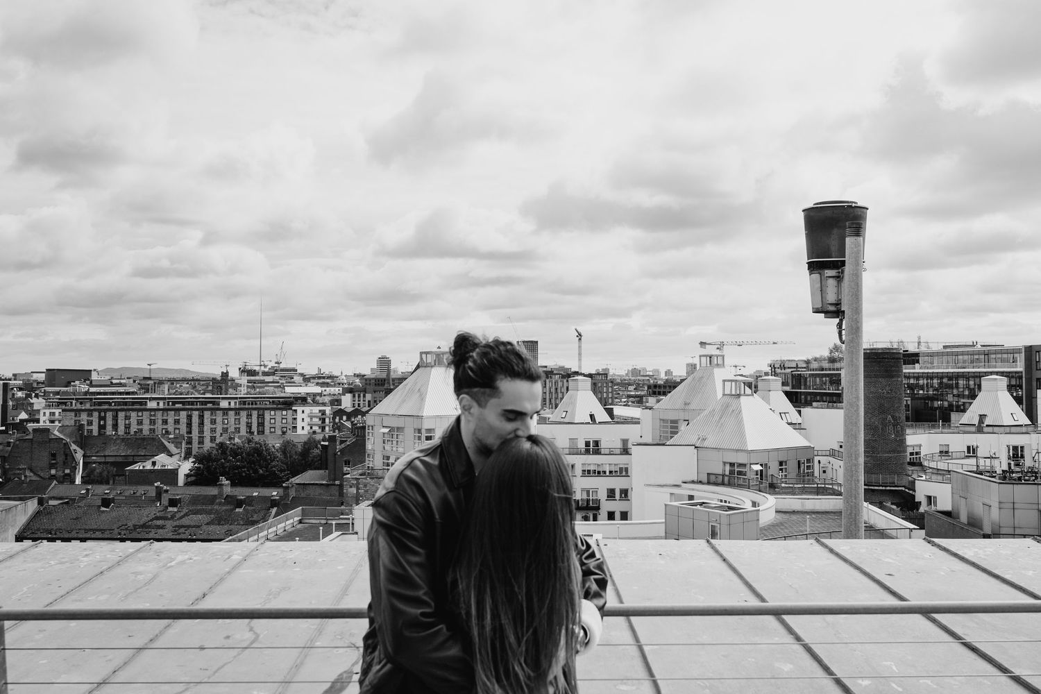 Black and white urban rooftop photographs showing industrial cityscape views and architecture. Couple's Photoshoot PHOTOGRAPHER Dublin