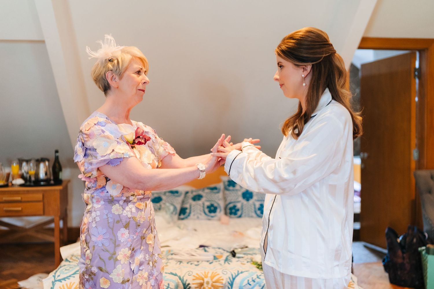 Bridesmaids in matching floral robes getting ready for wedding day festivities. Moody wedding portraits at the Set Theatre Kilkenny Ireland