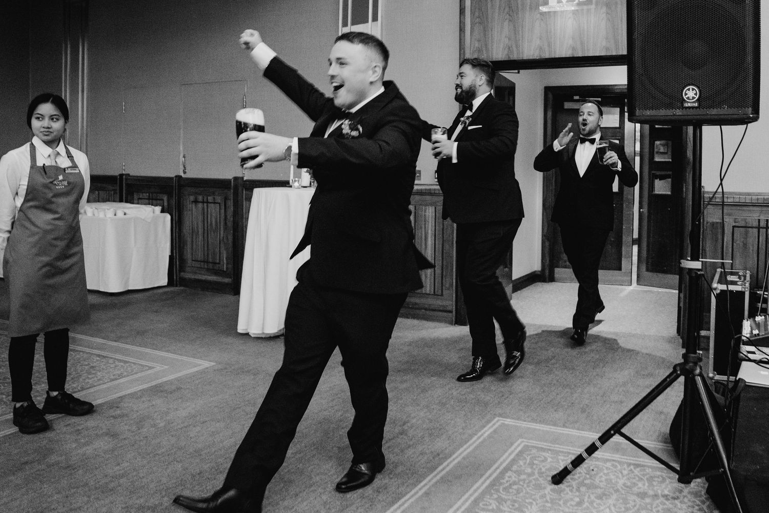 Dancing figures create dramatic silhouettes during indoor celebration.Wedding Photography Trim Castle Ireland