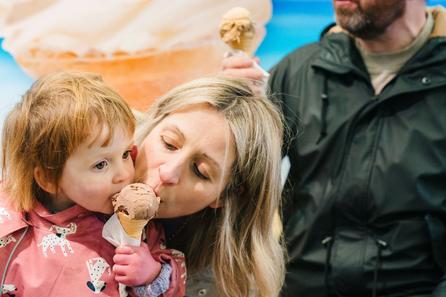 A parent and child enjoying ice cream together on a sunny day. PHOTOGRAPHER Dublin