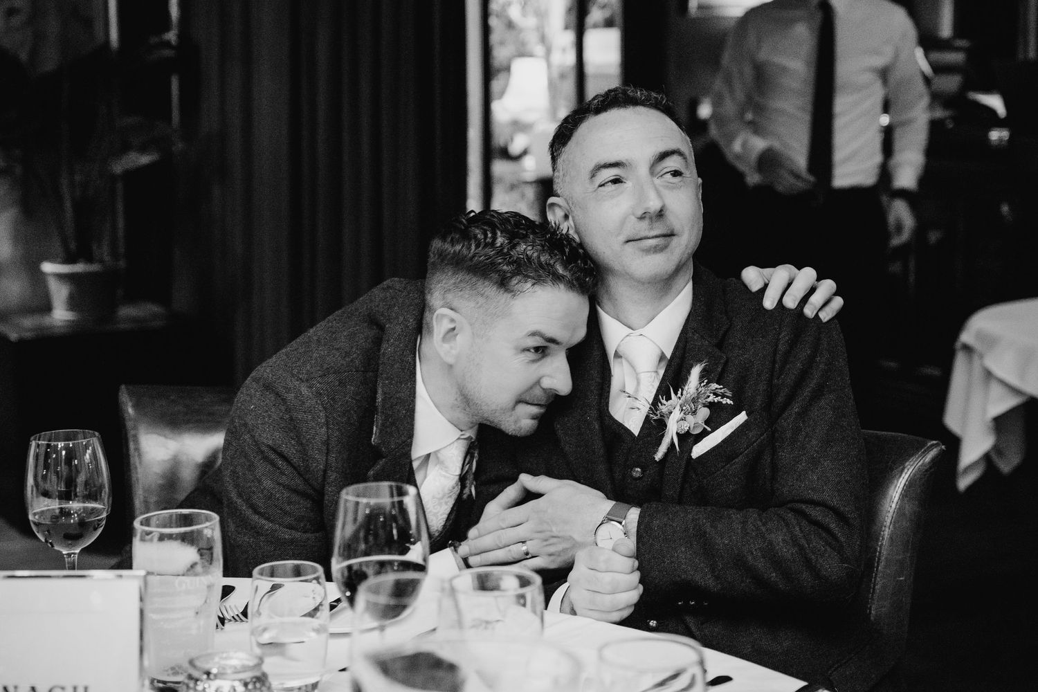 Black and white photo of guests dining at an elegant wedding reception. Marco Pierre Dublin Wedding Photographer