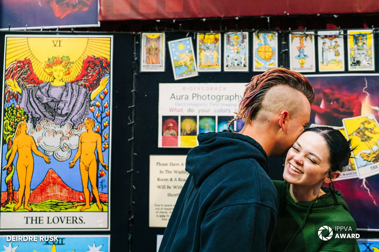 A couple embracing near a tarot card display featuring The Lovers card. PHOTOGRAPHER Dublin PHOTOGRAPHER Dublin