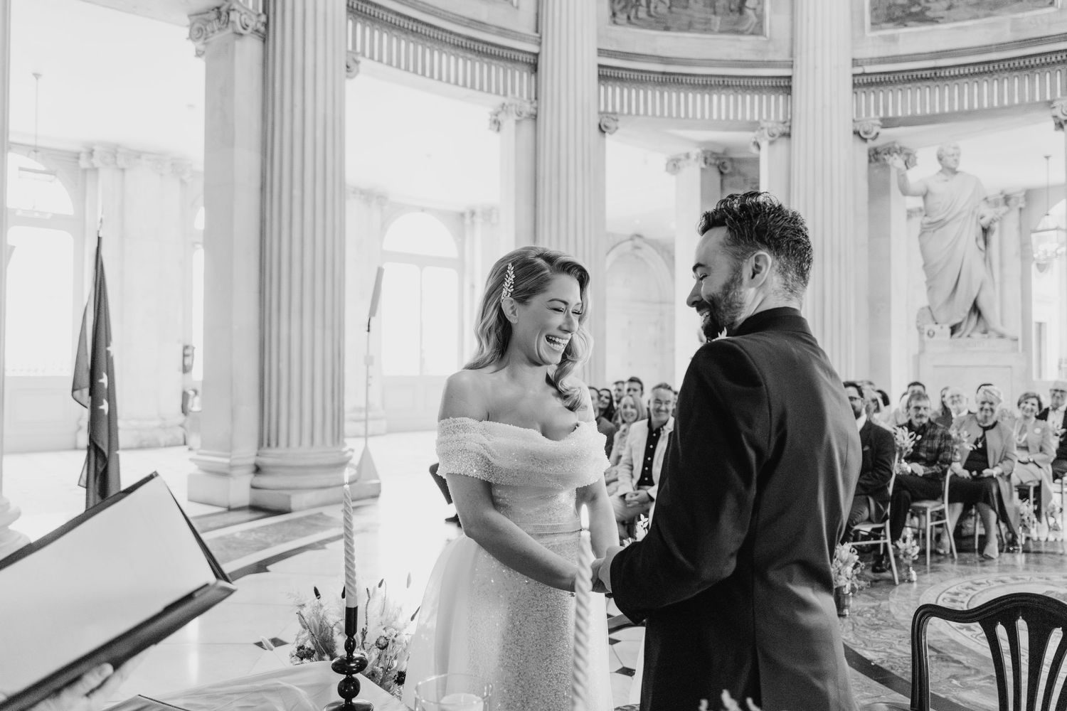 Romantic moments captured in an elegant white room with classical architectural details.  city hall dublin wedding photos