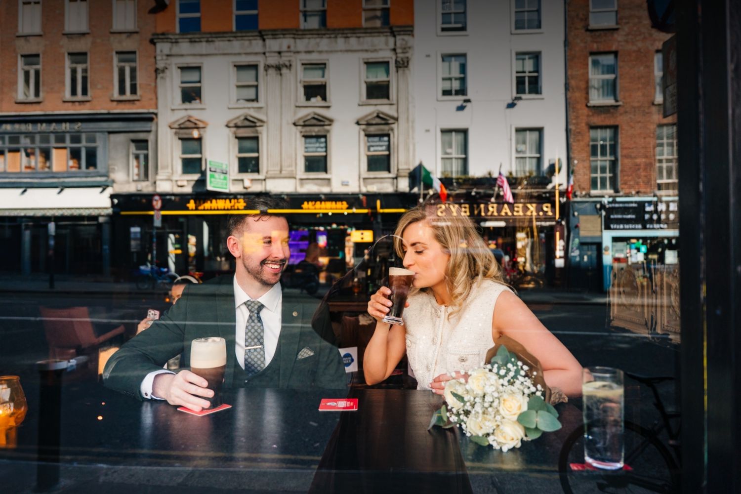 Wedding Photographer Dublin and Ireland. Wedding couple drinking guinness