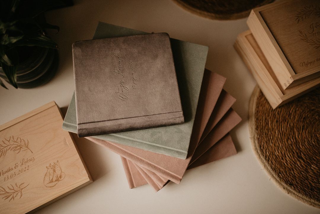 Vintage books and journals arranged in an aesthetic flatlay composition with warm brown tones.