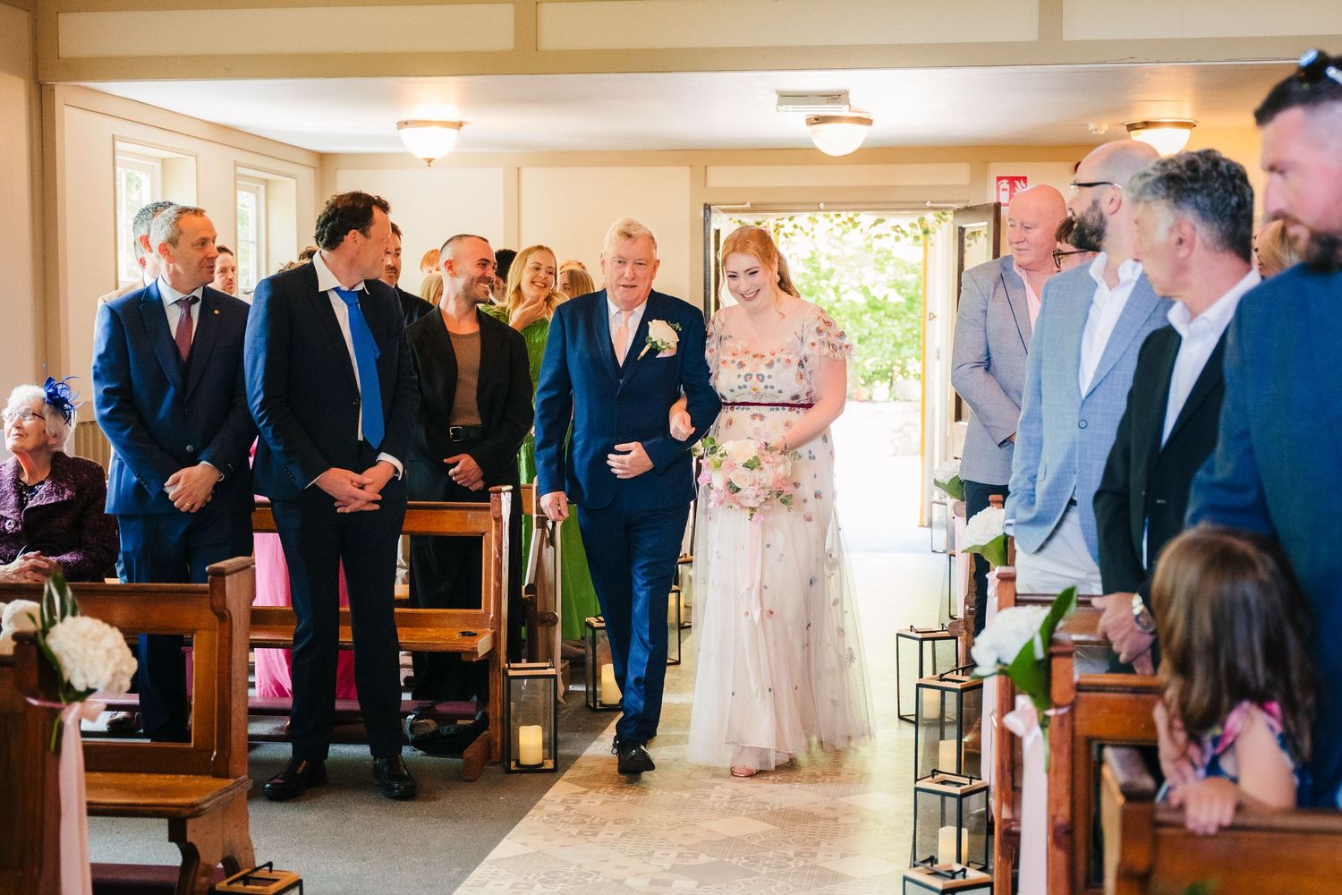 Wedding celebration montage showing guests dancing and celebrating together at various moments throughout the reception. . Village Barn Tyrr